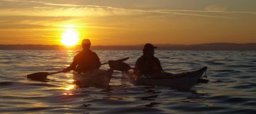 Paddler vor dem Sonnenaufgang